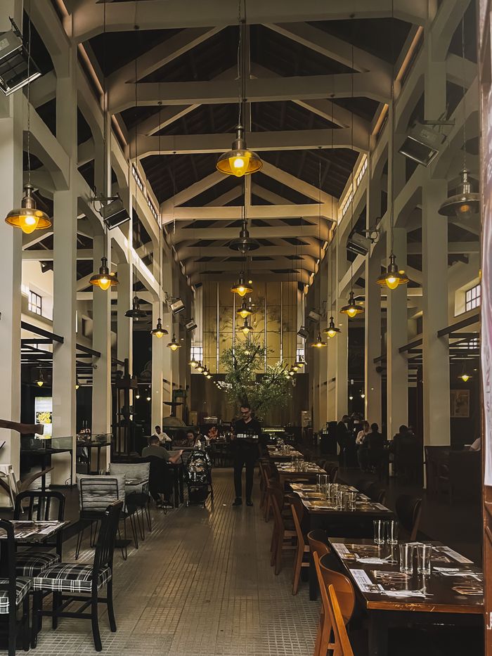 Spacious restaurant interior in Sicily with vintage design, ideal for dining experiences.